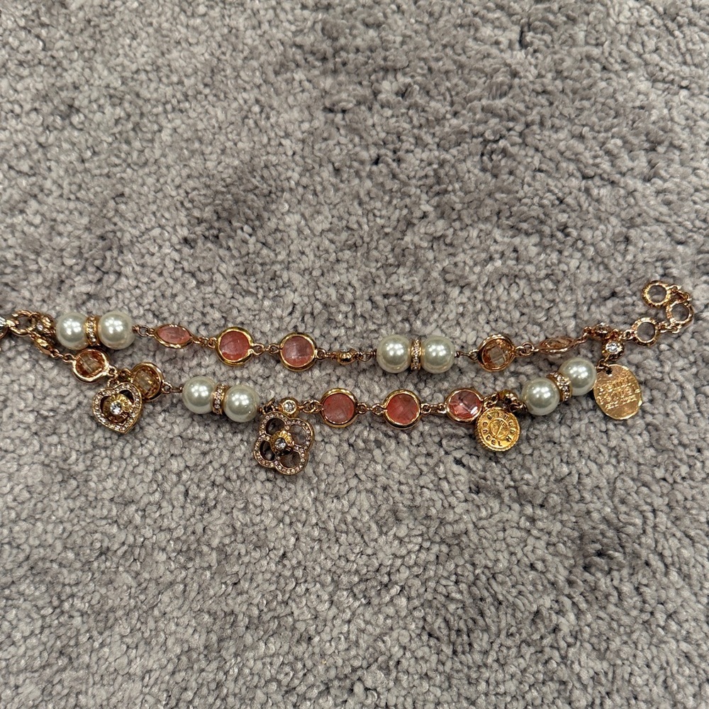 Henri Bendel Elegant Gold and Pink Charm Bracelet